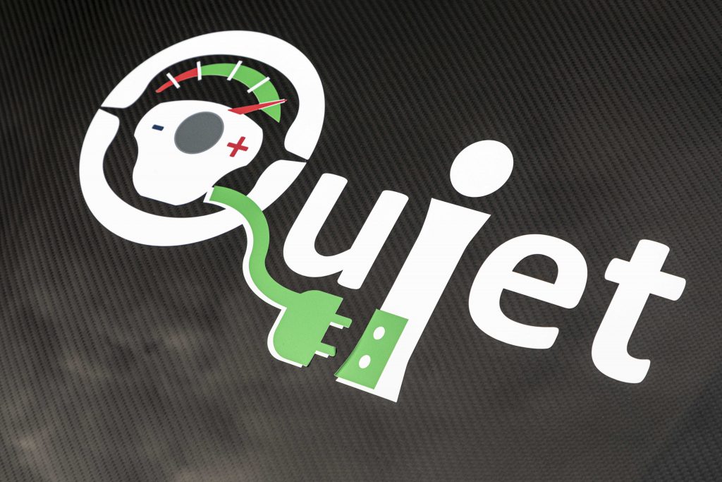 QUIET logo on car decoration.